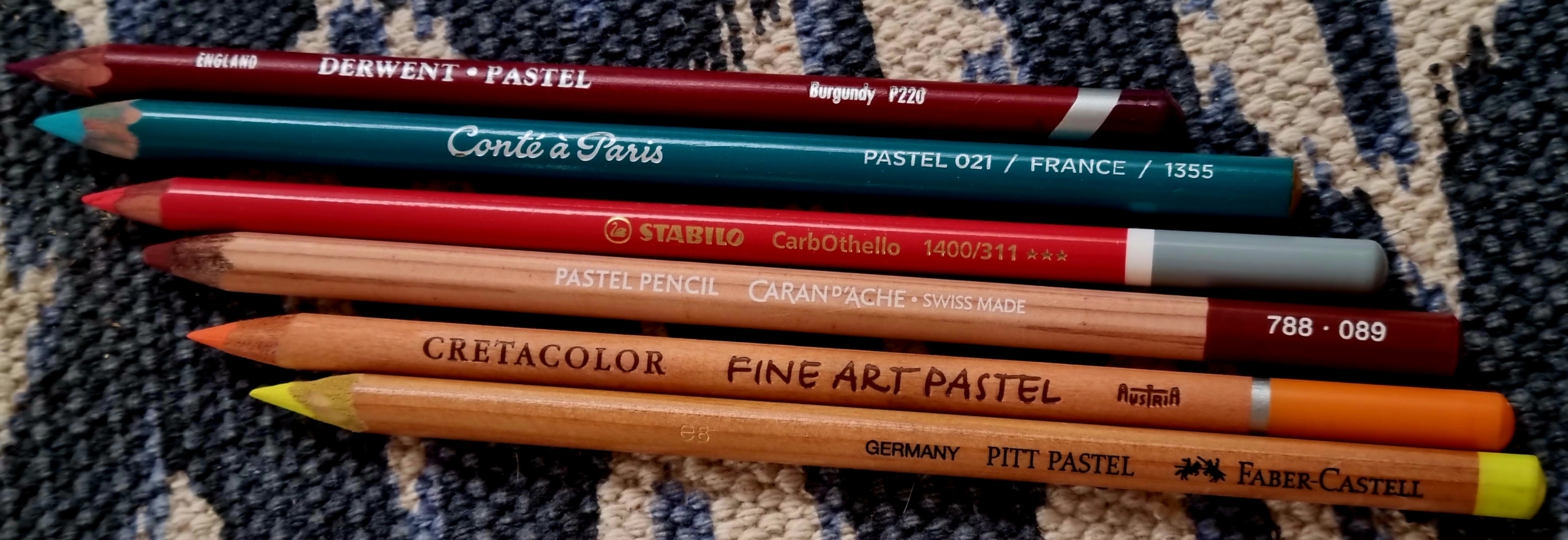 Different brands of pastel pencils